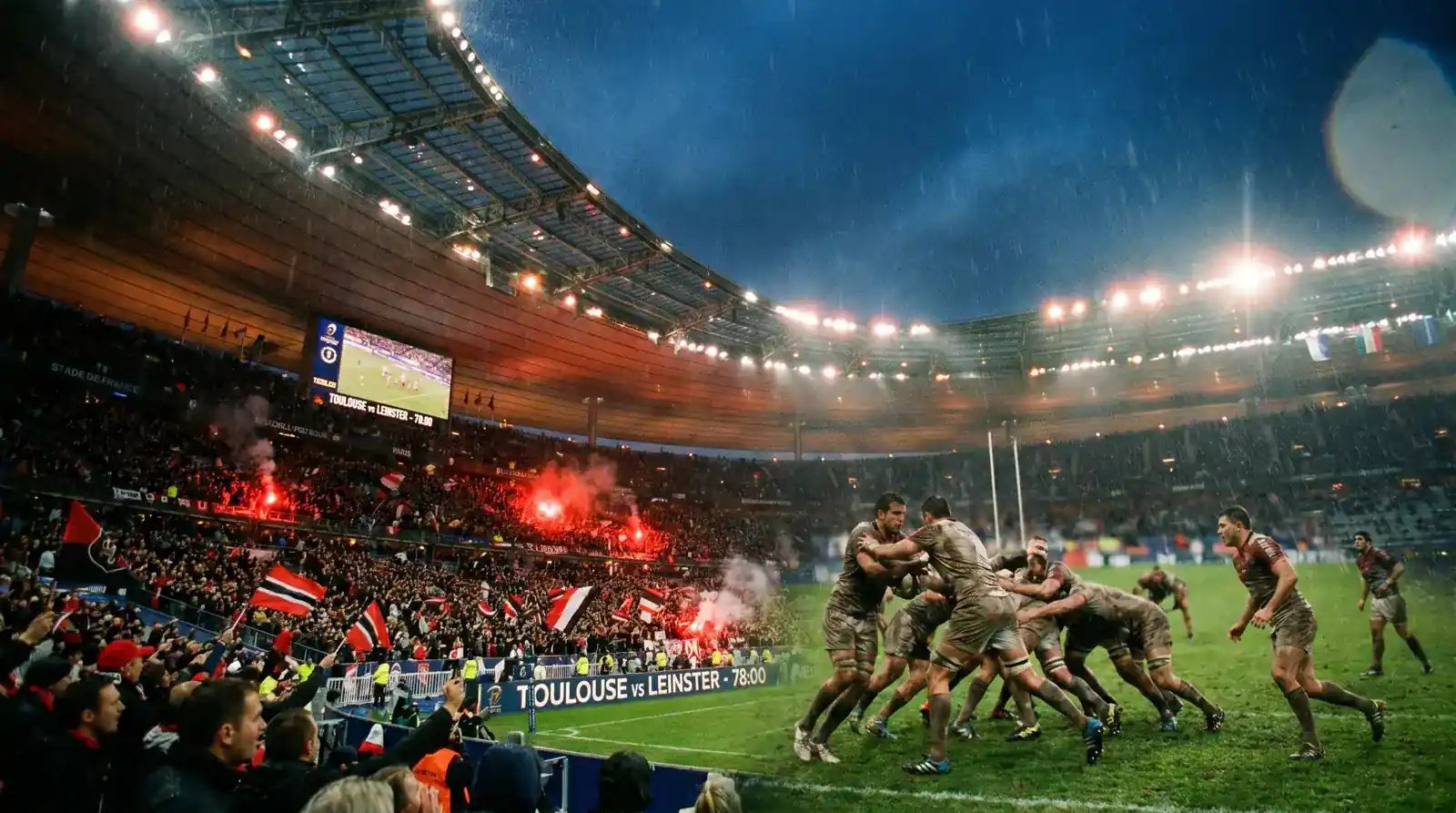 European club rugby match under lights at a packed continental stadium