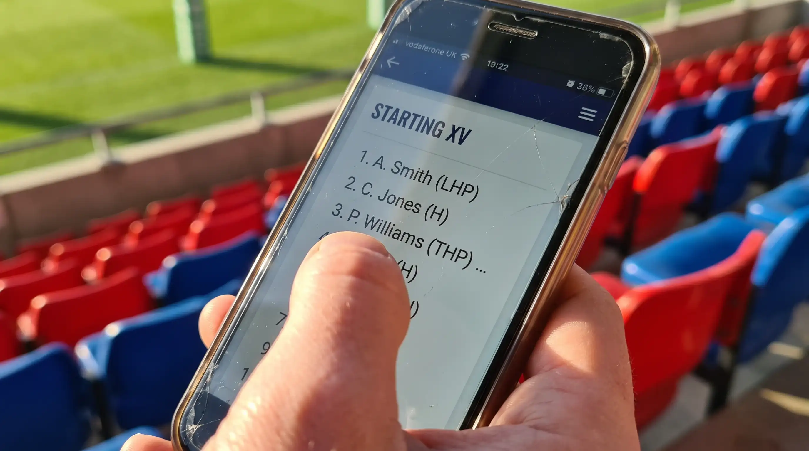 Close-up of a rugby team sheet displayed on a mobile device before kick-off