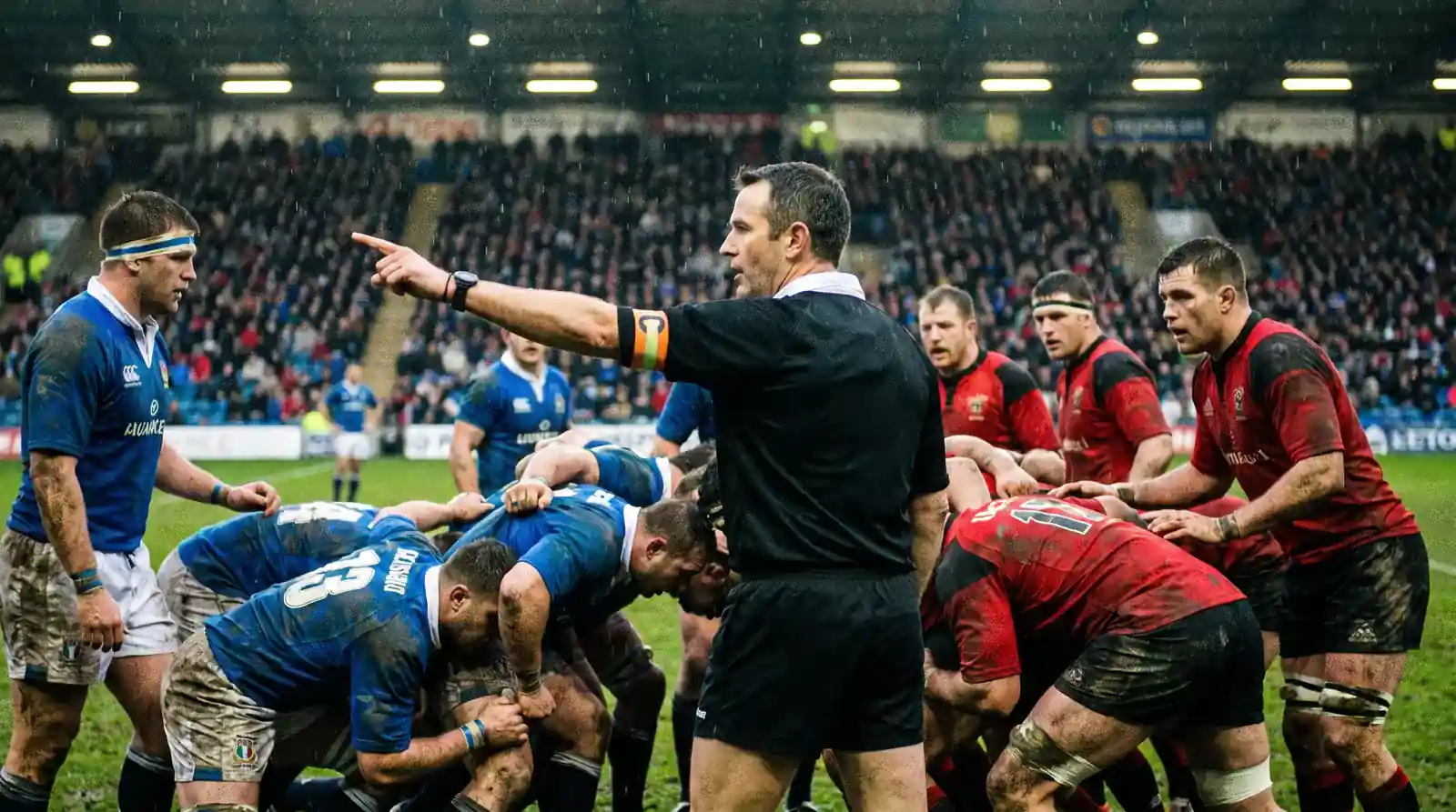 Rugby referee signalling a penalty decision during a Premiership match