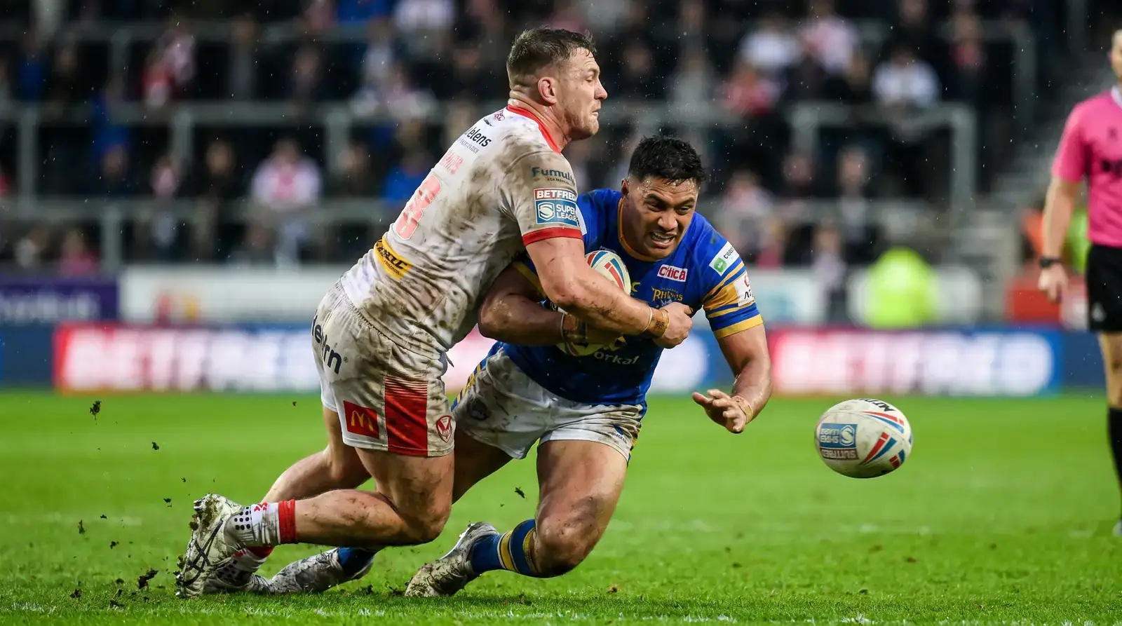 Powerful tackle in a Super League match demonstrating League-specific physicality