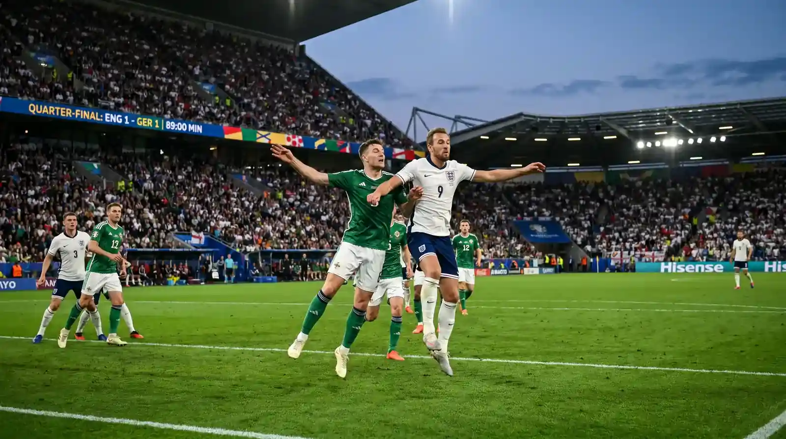 Quarter-final intensity with players contesting a high ball under pressure