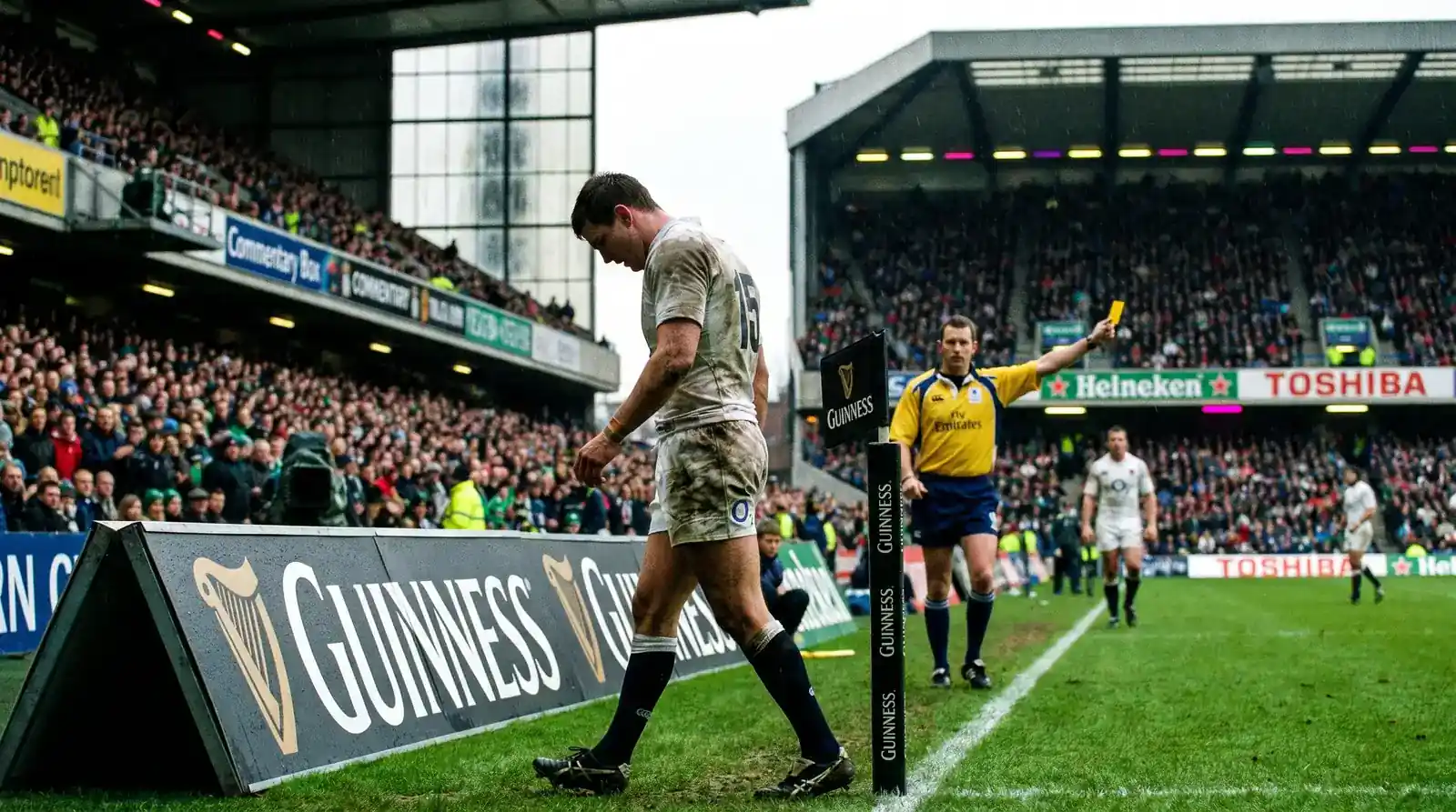 Rugby player receiving a yellow card and heading to the sin bin